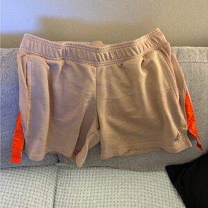 Adidas Women's Beige Shorts with Bright Orange Stripes